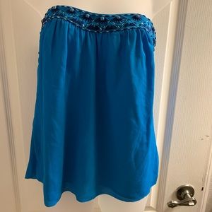 Strapless blue chiffon top.